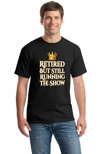 Grandma and grandpa wearing "Retired But Still Running the Show" funny retirement T-shirt, smiling with confidence.