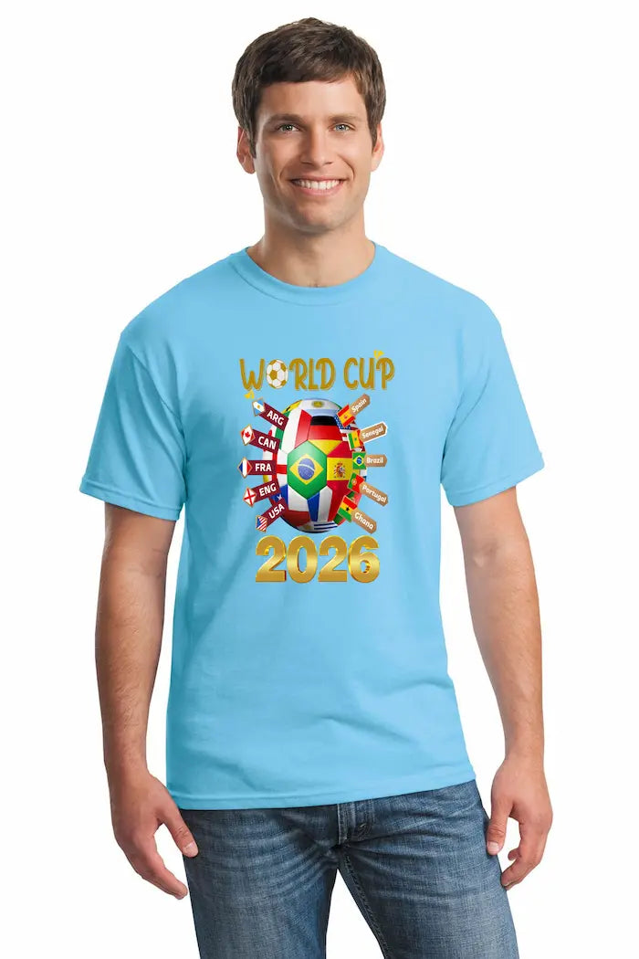 Bold blue World Cup 2026 T-shirt featuring vibrant multicolor flags and “UNITED IN CHAOS” typography, modeled in a festive street scene of fans celebrating.e