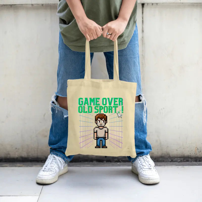 Retro pixel-style “Game Over, Old Sport!” tote bag inspired by 80s and 90s video games