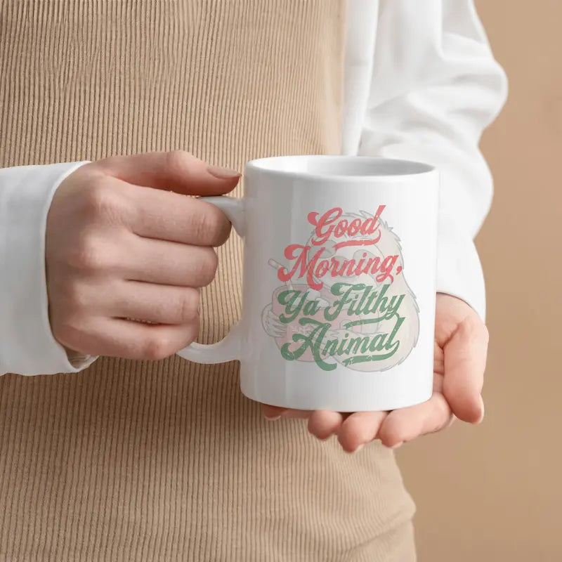 Good Morning You Filthy Animal Coffee Mug with bold black typography on white ceramic, sarcastic morning humor design