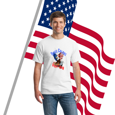 A patriotic graphic T-shirt with bold text reading “These Colors Don’t Run – Land of the Brave,” featuring American flag elements.