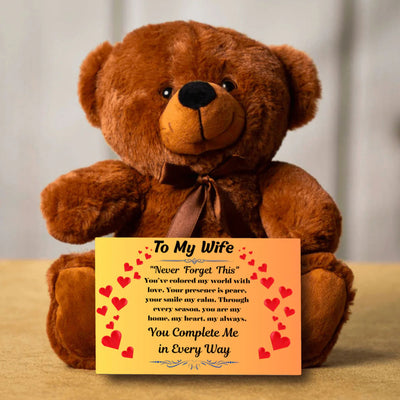 “Adorable plush teddy bear holding a heartfelt message card that reads ‘To My Wife’, designed as a sentimental gift for anniversaries, birthdays, or just because. Perfect for expressing love and appreciation.”