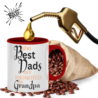 A white mug with the text 'The Best Dads Get Promoted to Grandpa' is displayed alongside a gold-colored fuel pump dispensing coffee beans into the mug, symbolizing fueling the next generation.