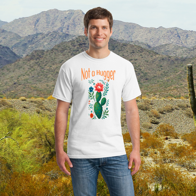 A graphic T-shirt featuring a cartoon cactus with the bold text “NOT A HUGGER” — designed for those with a sassy, no-hugs-please attitude.

