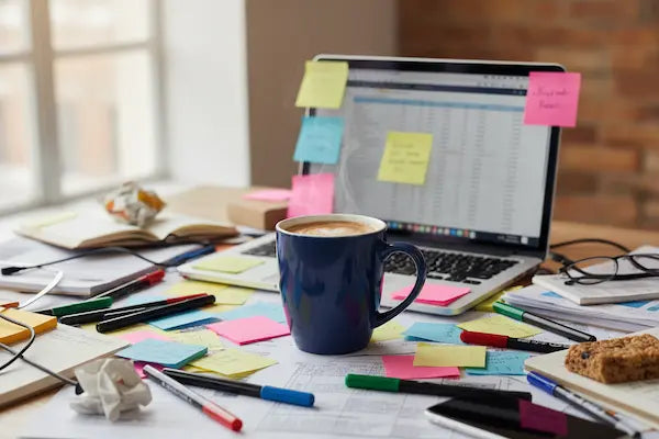 “Creative workspace behind Teka Originals designs – sketches, coffee cup, handmade gift ideas.”