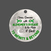 Green ribbon ornament with “I Know Someone With Alzheimer’s Disease” text in elegant font, symbolizing love, awareness, and memory preservation.