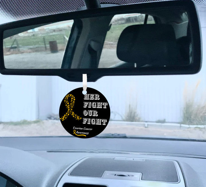 Yellow ribbon ornament with "HER FIGHT OUR FIGHT" etched design, supporting ovarian cancer awareness and research.