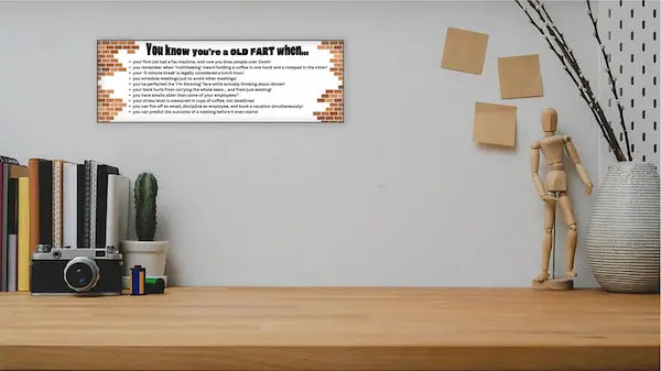 “You Know You’re an Old Fart When funny aging plaque hanging on a rustic wooden wall”