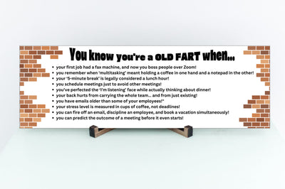 “You Know You’re an Old Fart When funny aging plaque hanging on a rustic wooden wall”