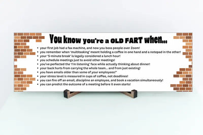 “You Know You’re an Old Fart When funny aging plaque hanging on a rustic wooden wall”
