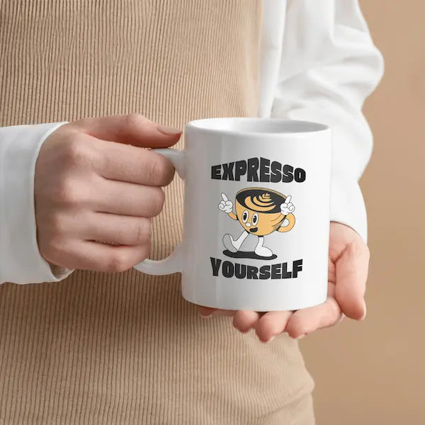 White mug with cartoon cup character and 'Expresso Yourself' text on a kitchen counter.