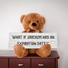 A teddy bear sitting on a wooden surface holding a sign with the phrase 'WHAT IF SARCASM HAD AN EXPIRATION DATE?'