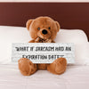 A teddy bear sitting on a wooden surface holding a sign with the phrase 'WHAT IF SARCASM HAD AN EXPIRATION DATE?'