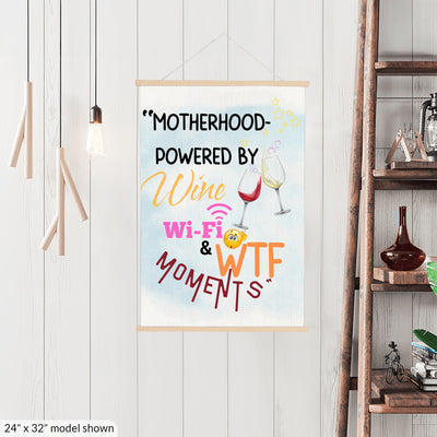 Funny Mother’s Day wall sign – “Motherhood Powered By Win, WiFi, & WTF Moments” hanging canvas quote décor for moms.

