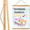 Funny Mother’s Day wall sign – “Motherhood Powered By Win, WiFi, & WTF Moments” hanging canvas quote décor for moms.

