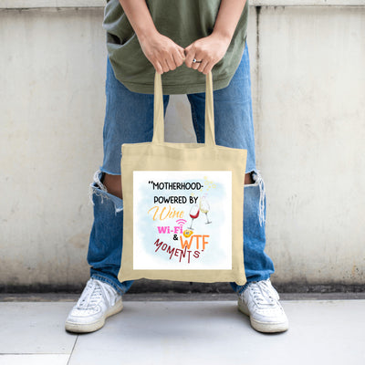 Funny Mother’s Day tote bag – “Motherhood Powered By Win, WiFi, & WTF Moments” quote bag for moms.