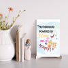 Mother’s Day hanging plaque – “Motherhood Powered By Win, WiFi, & WTF Moments” funny wall décor for moms.