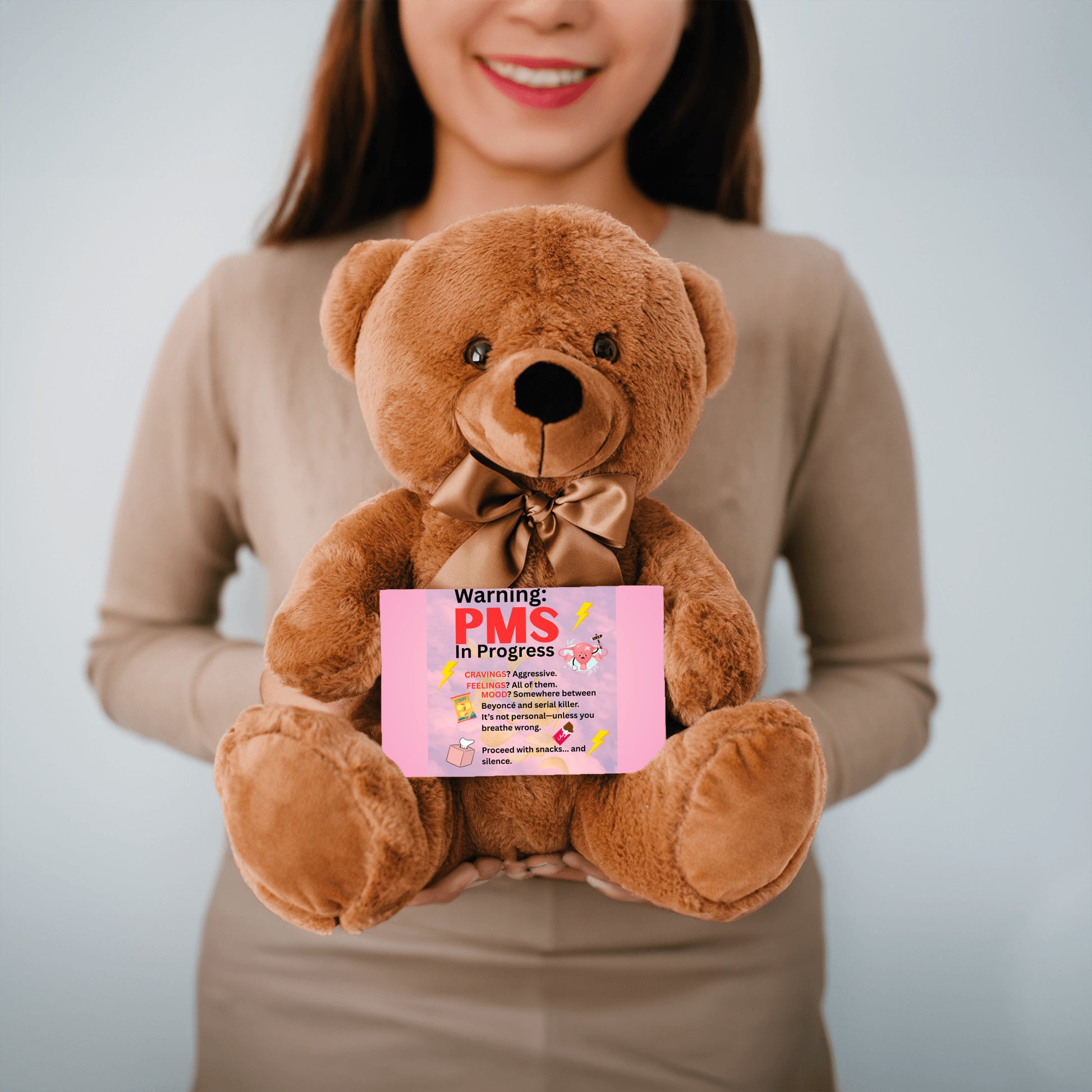 Bold comic-style PMS warning card with a pink storm background, cartoon icons like thunderclouds, chocolate bars, and explosive emojis, delivering a humorous and edgy message.