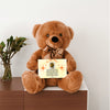 “Adorable plush teddy bear holding a heartfelt message card that reads ‘To My Wife’, designed as a sentimental gift for anniversaries, birthdays, or just because. Perfect for expressing love and appreciation.”