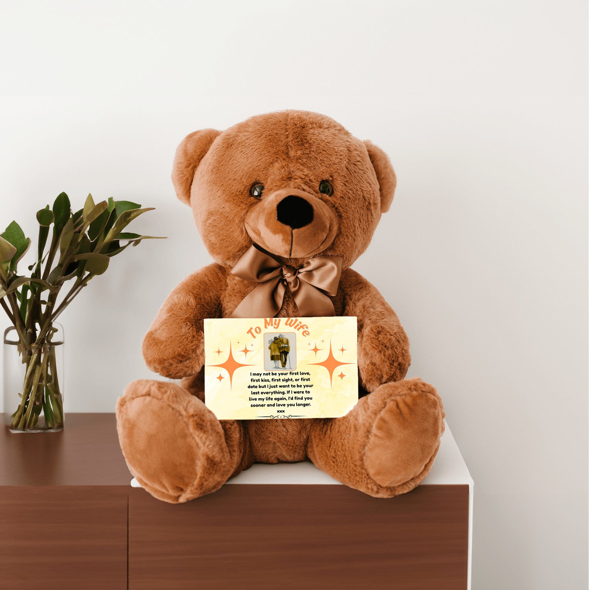 “Adorable plush teddy bear holding a heartfelt message card that reads ‘To My Wife’, designed as a sentimental gift for anniversaries, birthdays, or just because. Perfect for expressing love and appreciation.”