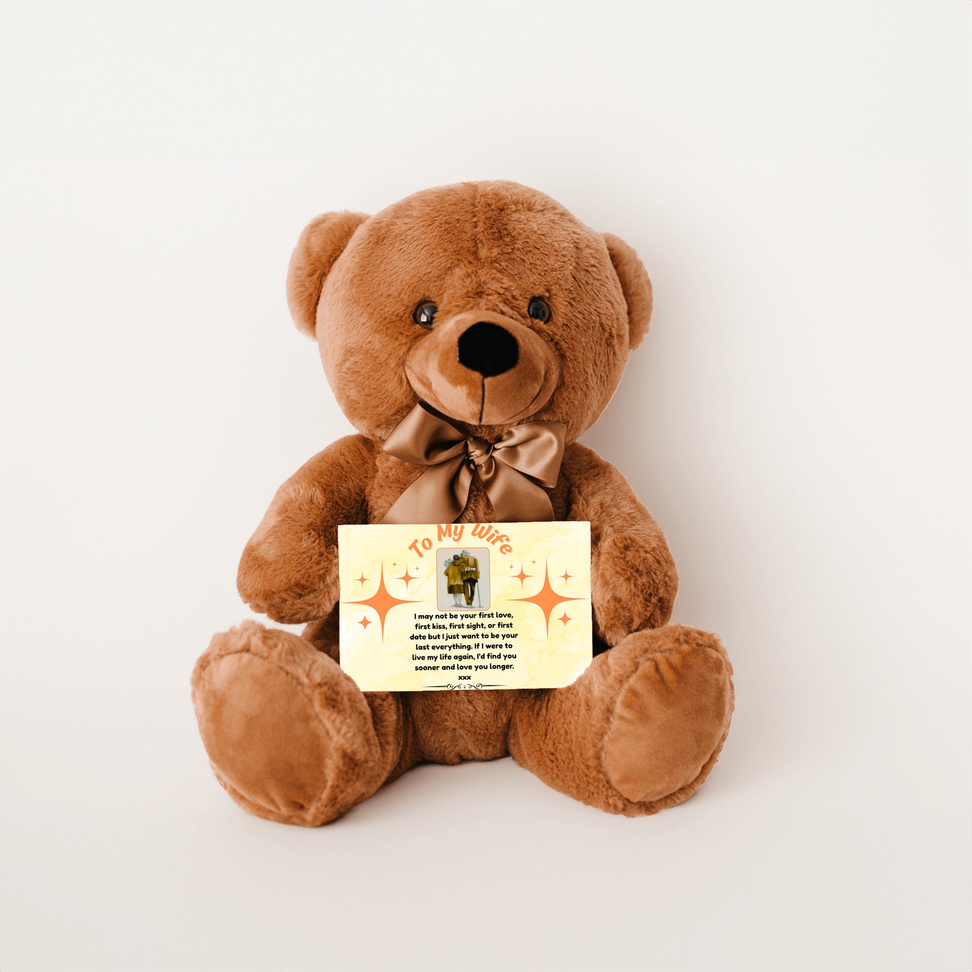 “Adorable plush teddy bear holding a heartfelt message card that reads ‘To My Wife’, designed as a sentimental gift for anniversaries, birthdays, or just because. Perfect for expressing love and appreciation.”