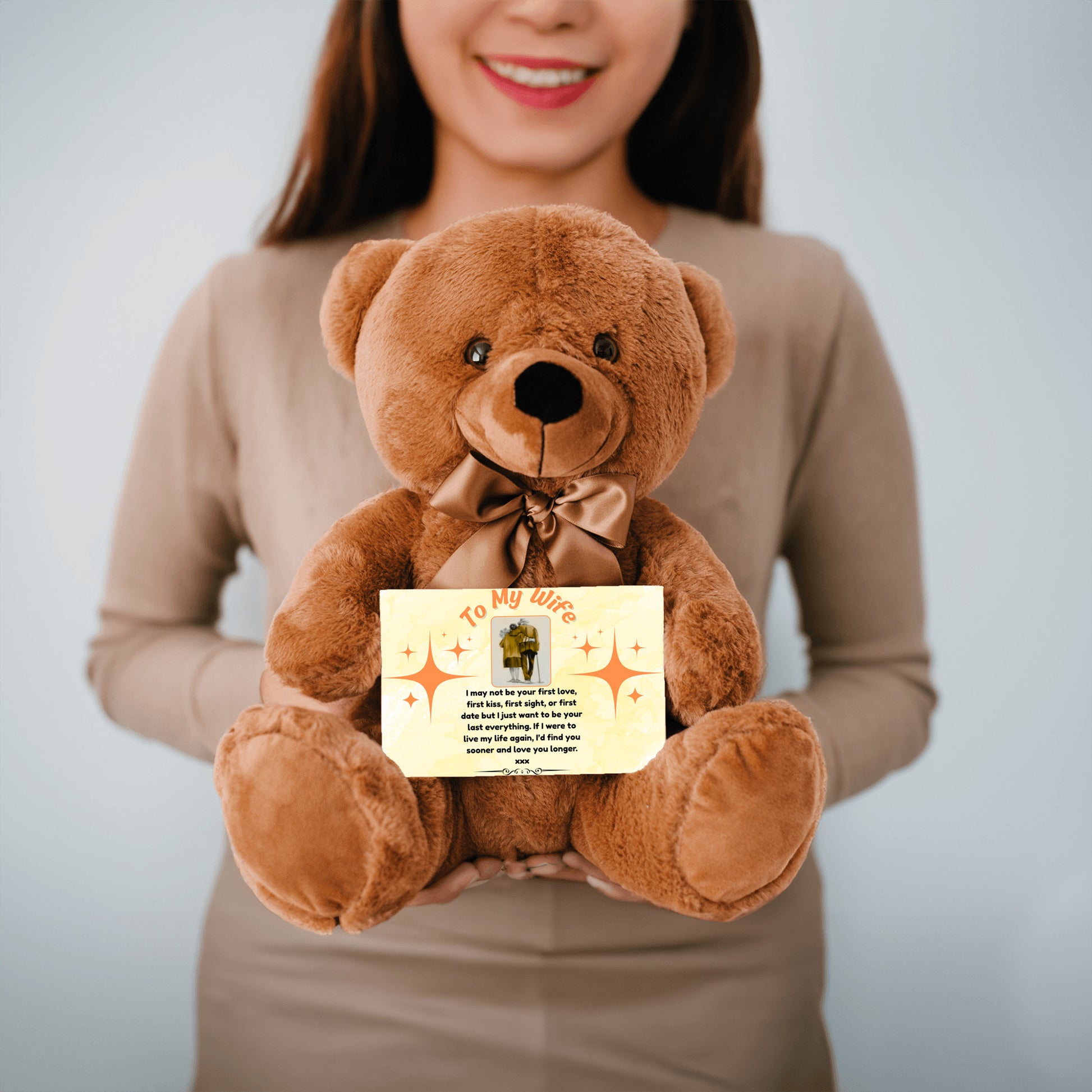 “Adorable plush teddy bear holding a heartfelt message card that reads ‘To My Wife’, designed as a sentimental gift for anniversaries, birthdays, or just because. Perfect for expressing love and appreciation.”