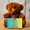 "Plush teddy bear holding a card with the message 'Mom, We Love You – Forever Our Guide' on a pink floral background."