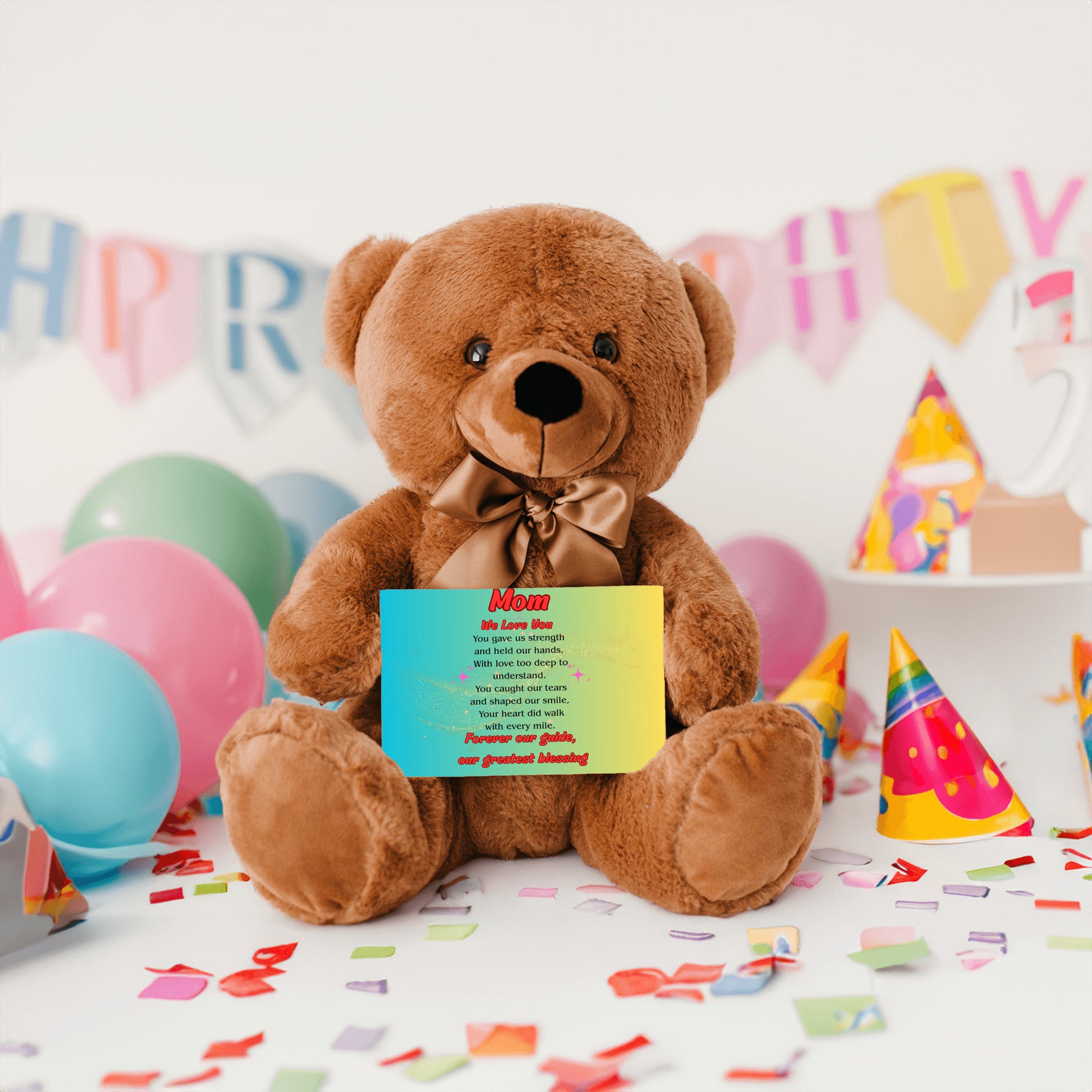 "Plush teddy bear holding a card with the message 'Mom, We Love You – Forever Our Guide' on a pink floral background."