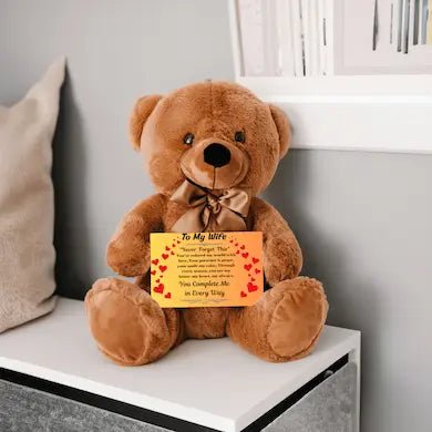 “Adorable plush teddy bear holding a heartfelt message card that reads ‘To My Wife’, designed as a sentimental gift for anniversaries, birthdays, or just because. Perfect for expressing love and appreciation.”