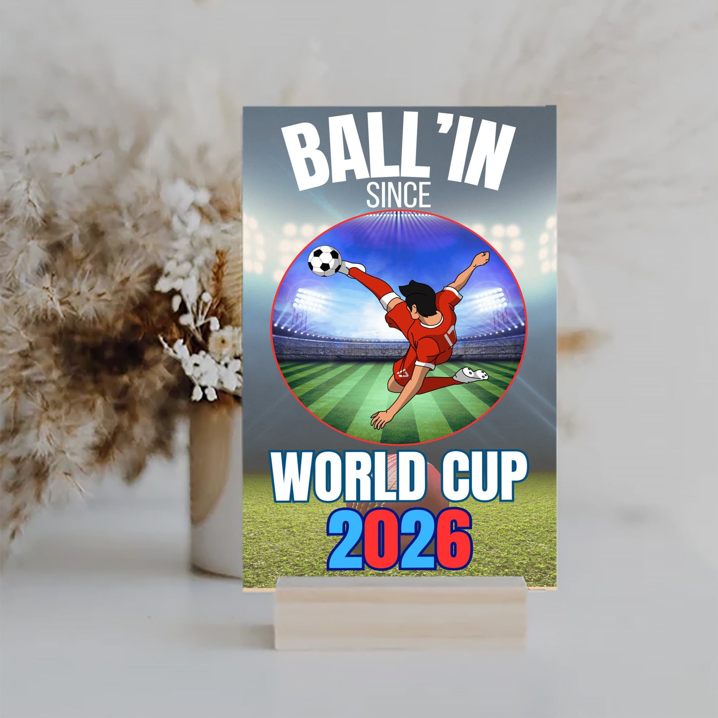 A humorous design with bold text reading “BALL’IN SINCE WORLD CUP 2026,” styled in athletic lettering and a sporty, sarcastic theme.