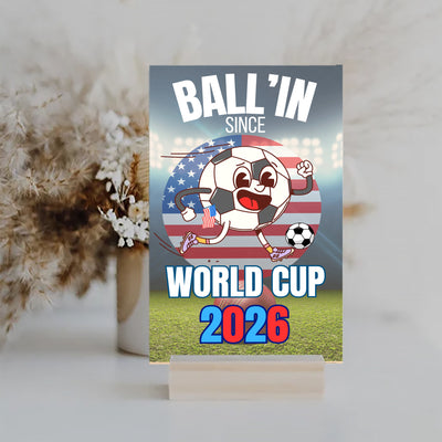 A humorous design with bold text reading “BALL’IN SINCE WORLD CUP 2026,” styled in athletic lettering and a sporty, sarcastic theme.