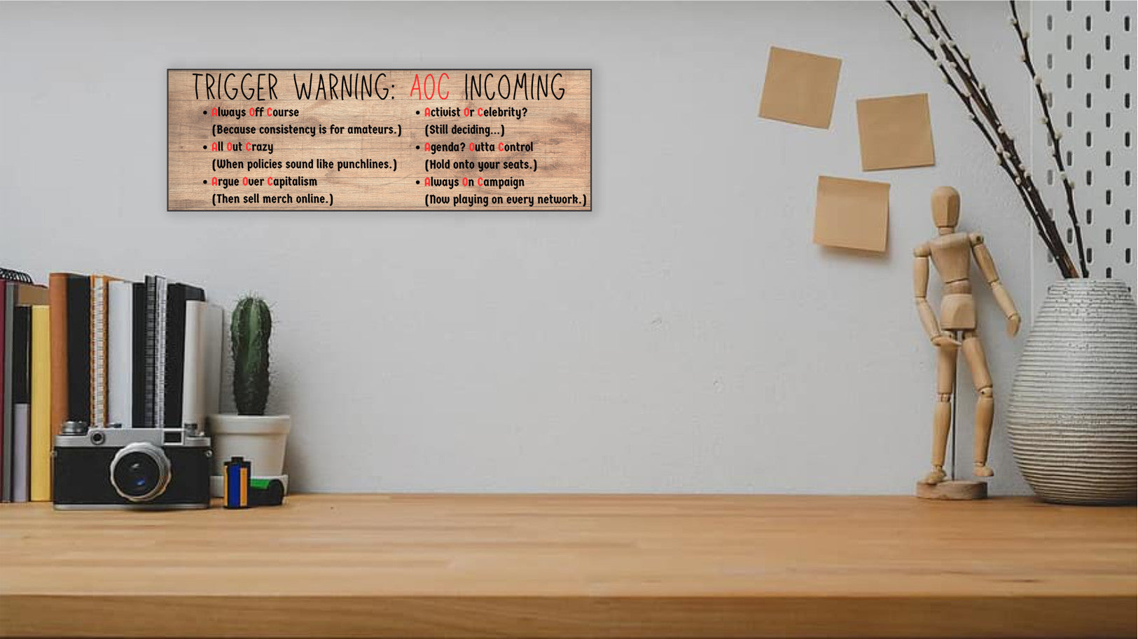 “All Out Comedy Plaque TRIGGER WARNING AOC Show political humor wall decor hanging on a wooden background”