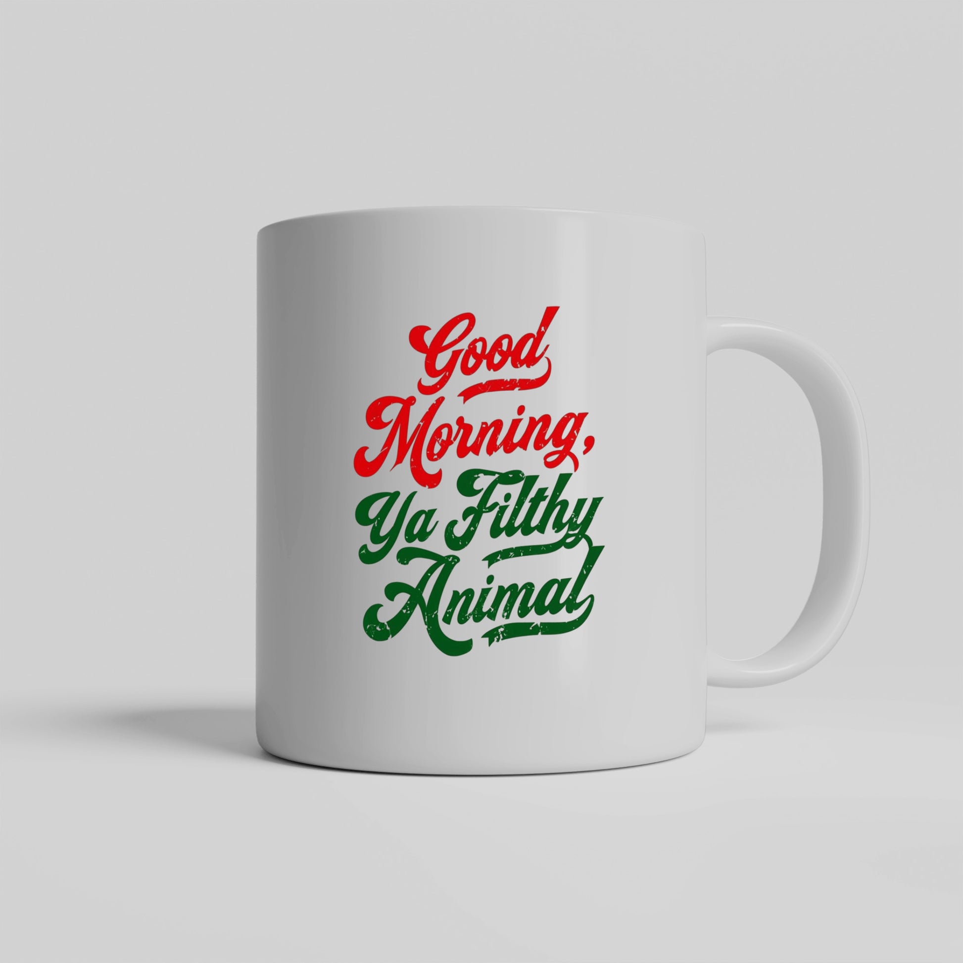White ceramic mug that says “Good Morning, Ya Filthy Animal” in bold black font – perfect for sarcastic coffee lovers.