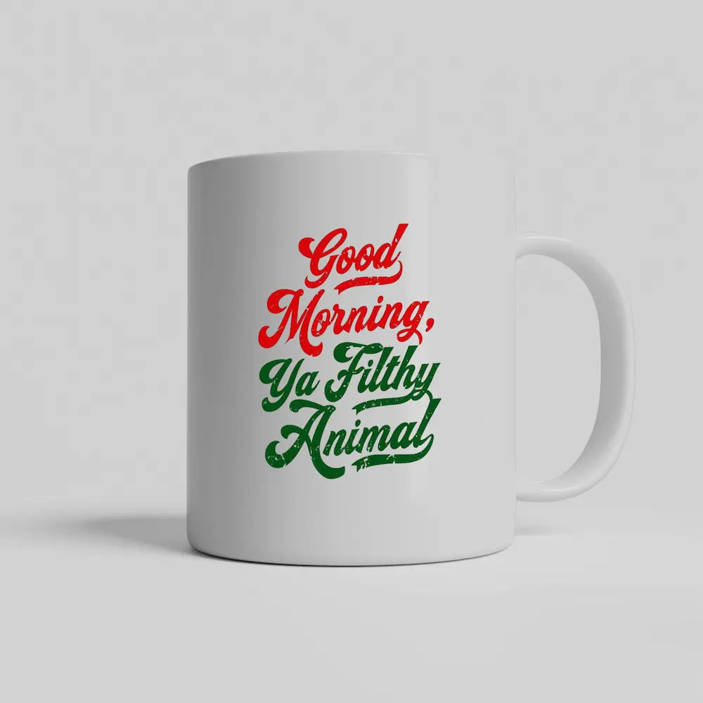 White ceramic mug that says “Good Morning, Ya Filthy Animal” in bold black font – perfect for sarcastic coffee lovers.