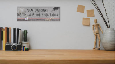 Funny bartender plaque that reads “Dear Customers: The Tip Jar Is Not Just a Decoration”