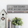 Funny bartender plaque that reads “Dear Customers: The Tip Jar Is Not Just a Decoration”
