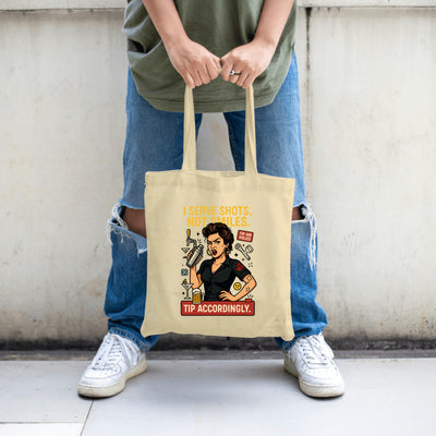 "Canvas tote bag featuring the quote 'I Serve Shots, Not Smiles' in bold, edgy lettering – perfect for bartenders and servers."