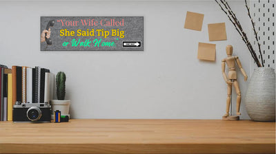 Funny bartender plaque that reads “Your Wife Called. She Said Tip Big or Walk Home” in bold neon letters.