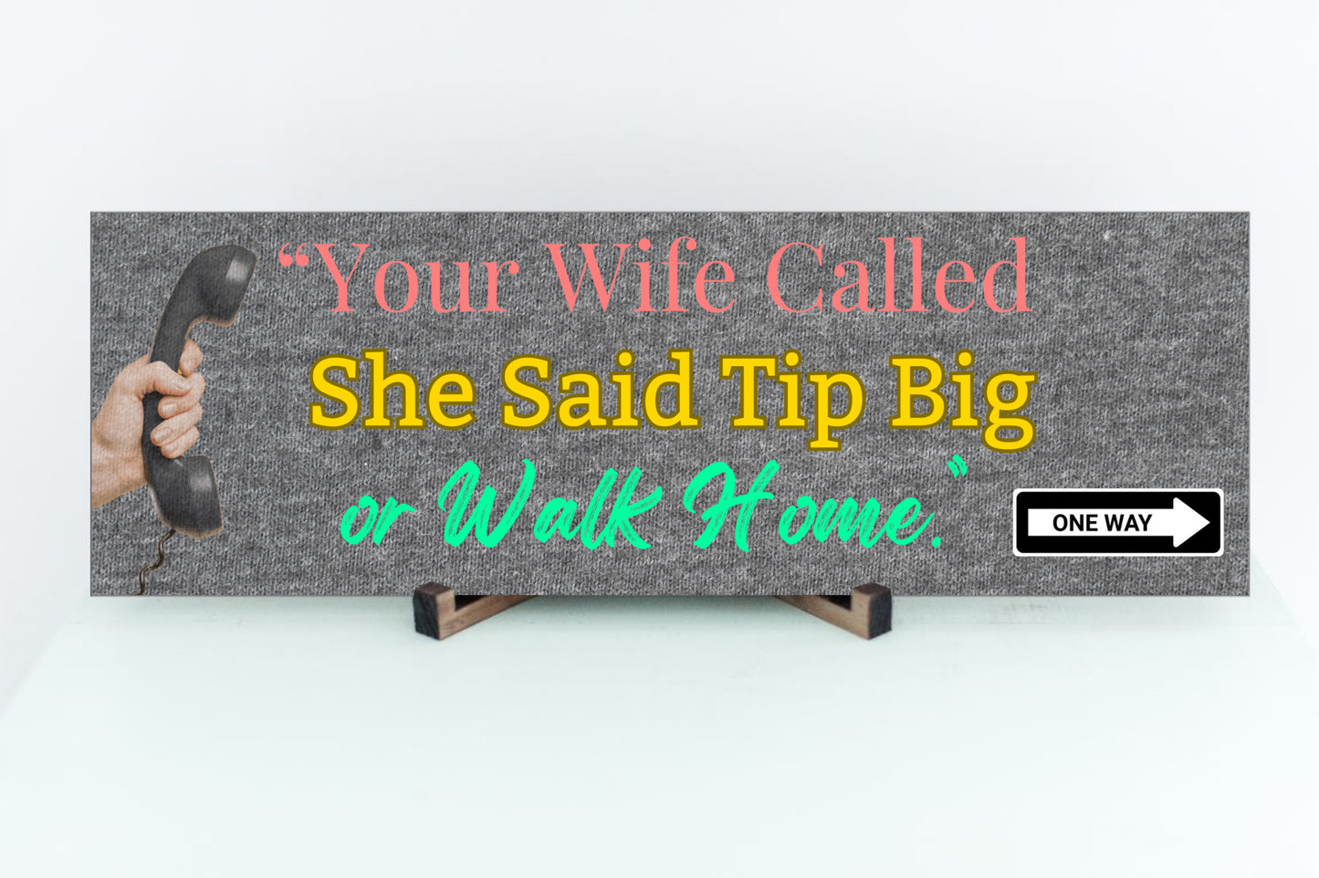 Funny bartender plaque that reads “Your Wife Called. She Said Tip Big or Walk Home” in bold neon letters.
