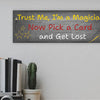 Sarcastic magician-themed plaque with the quote “Trust Me, I’m a Magician – Now Pick a Card and Get Lost” in vintage typeface on a bold backdrop.