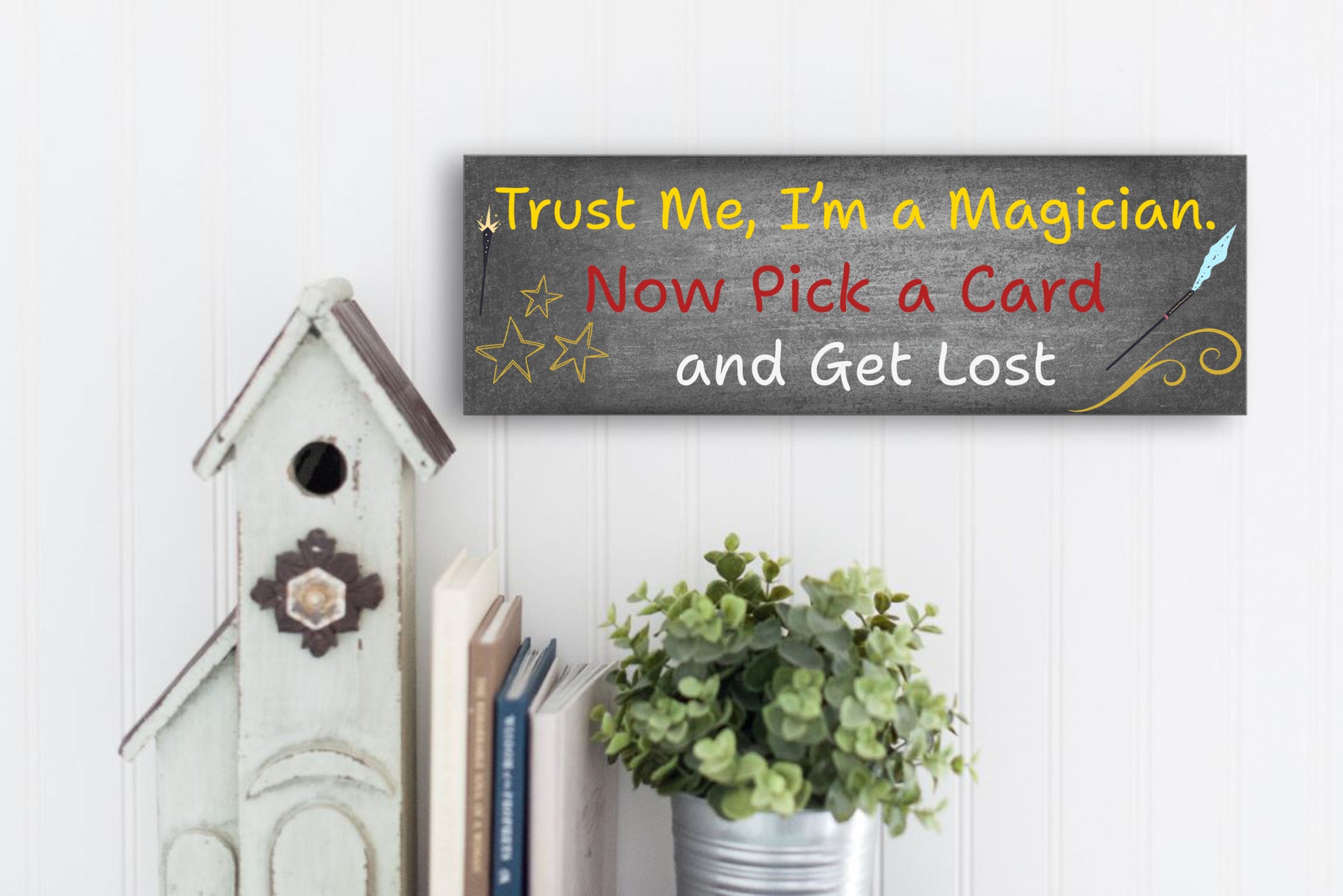 Sarcastic magician-themed plaque with the quote “Trust Me, I’m a Magician – Now Pick a Card and Get Lost” in vintage typeface on a bold backdrop.
