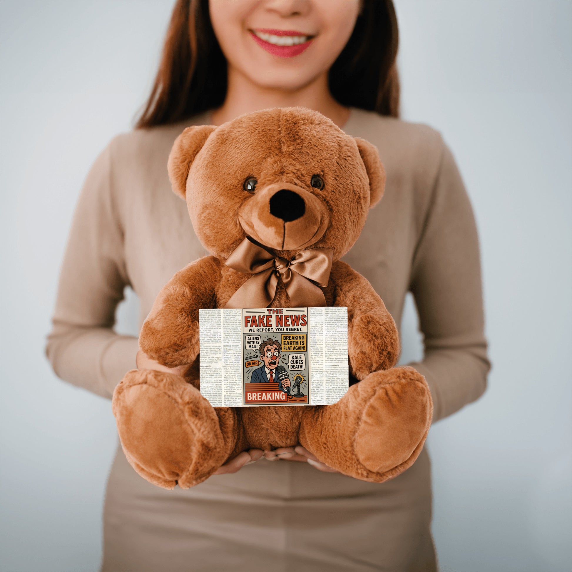 Soft plush teddy bear holding a sign that reads “Teddy Bears Tell the Truth – Not the Fake News,” a funny political and novelty gift.