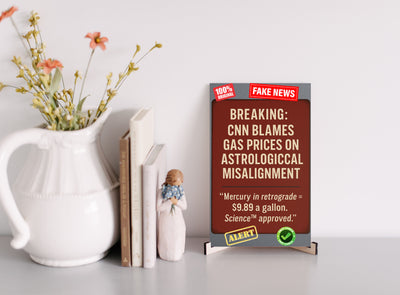 “CNN Blames Gas Prices on Astrological Misalignment satirical plaque on rustic wall”