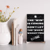 "Minimalist motivational plaque on white wall background"