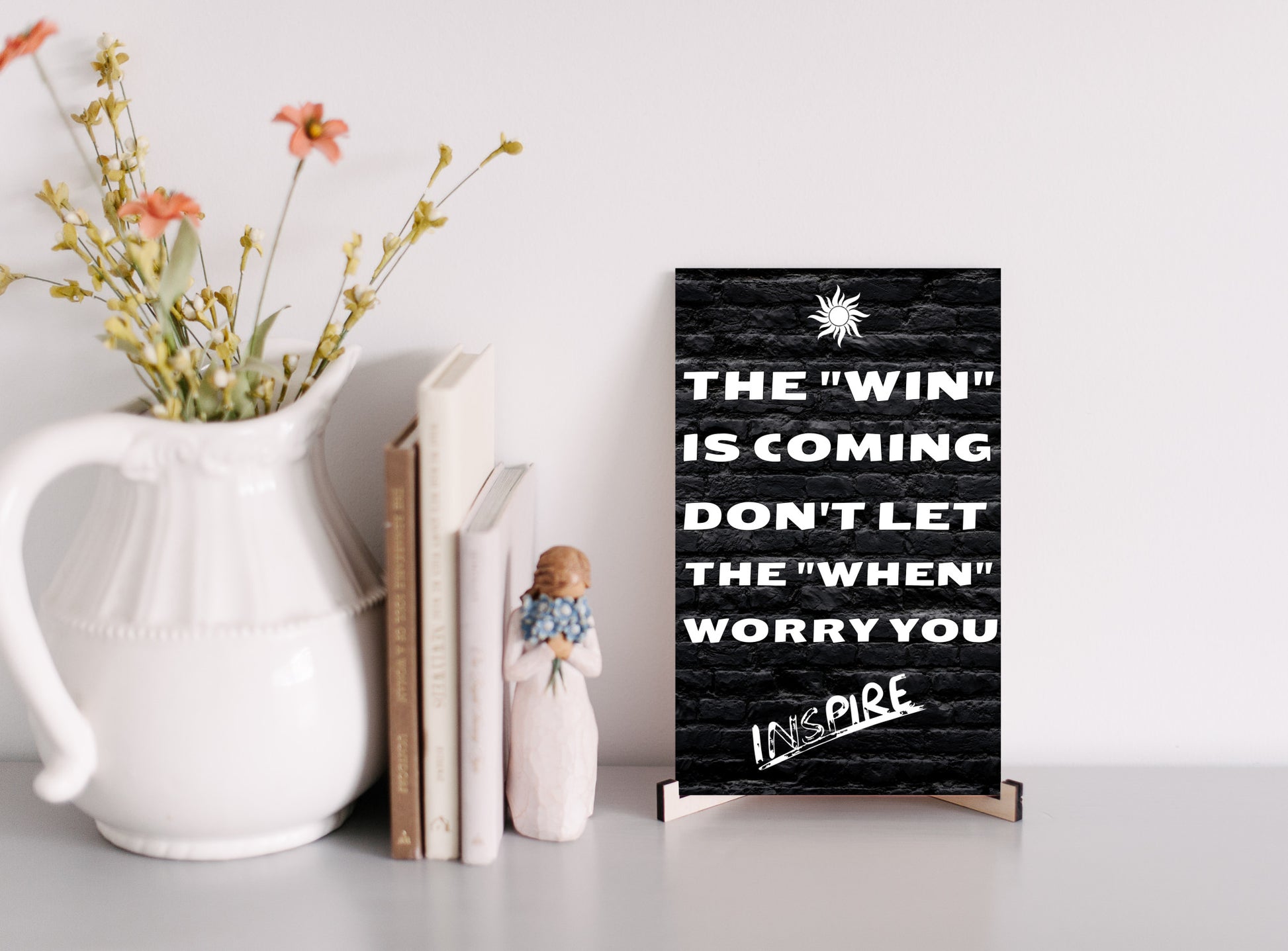 "Minimalist motivational plaque on white wall background"