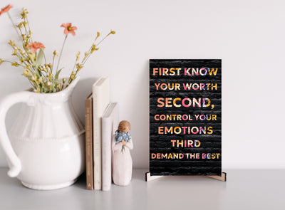 “Decorative wall sign in black and white minimalist font.”