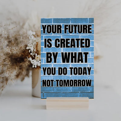 “Motivational funny plaque with bold black text – Your Future Is Created by What You Do Today”

