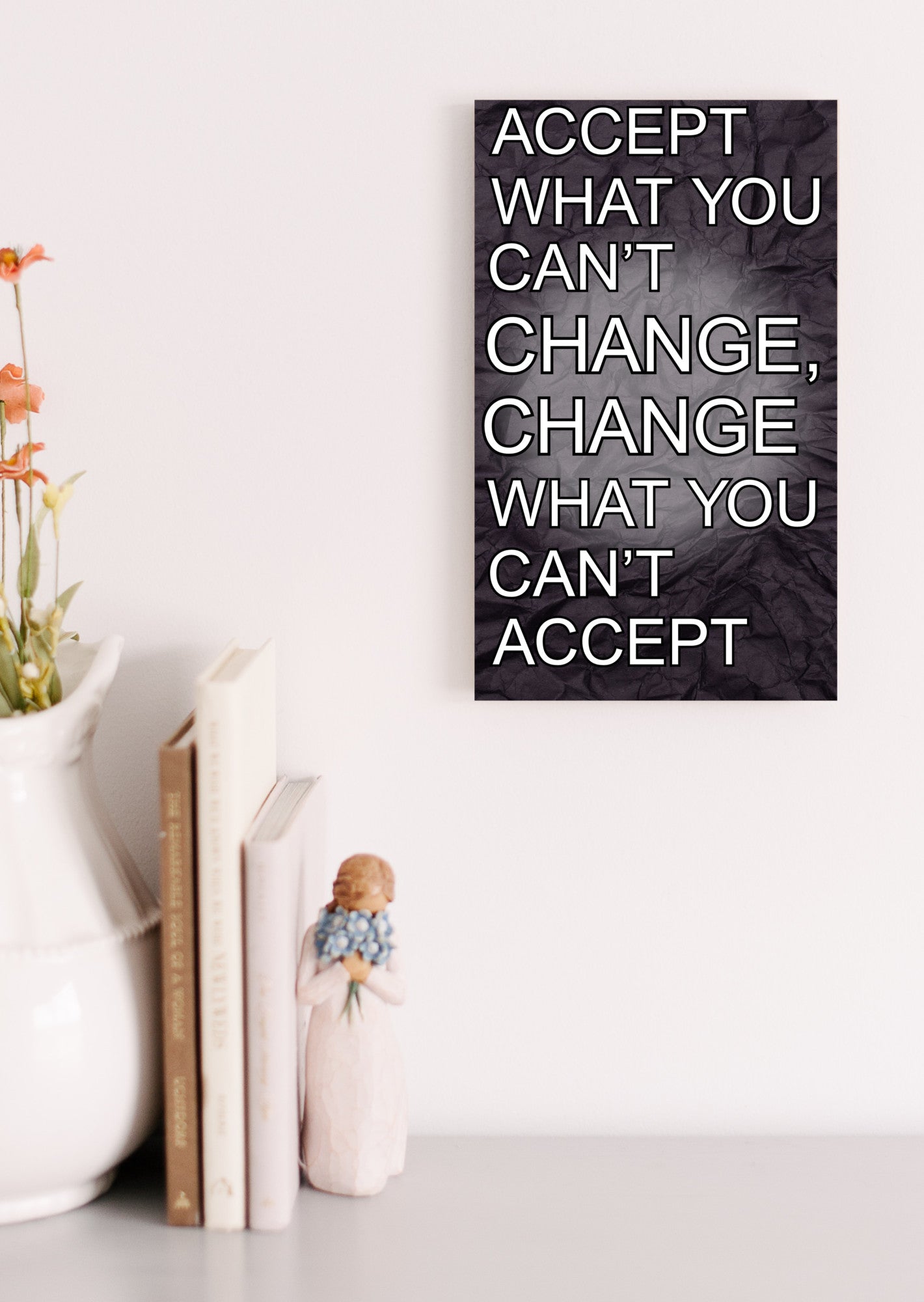A wood-finish plaque with bold black text that reads “Accept What You Can’t Change” in capital letters, set in a clean and modern font.