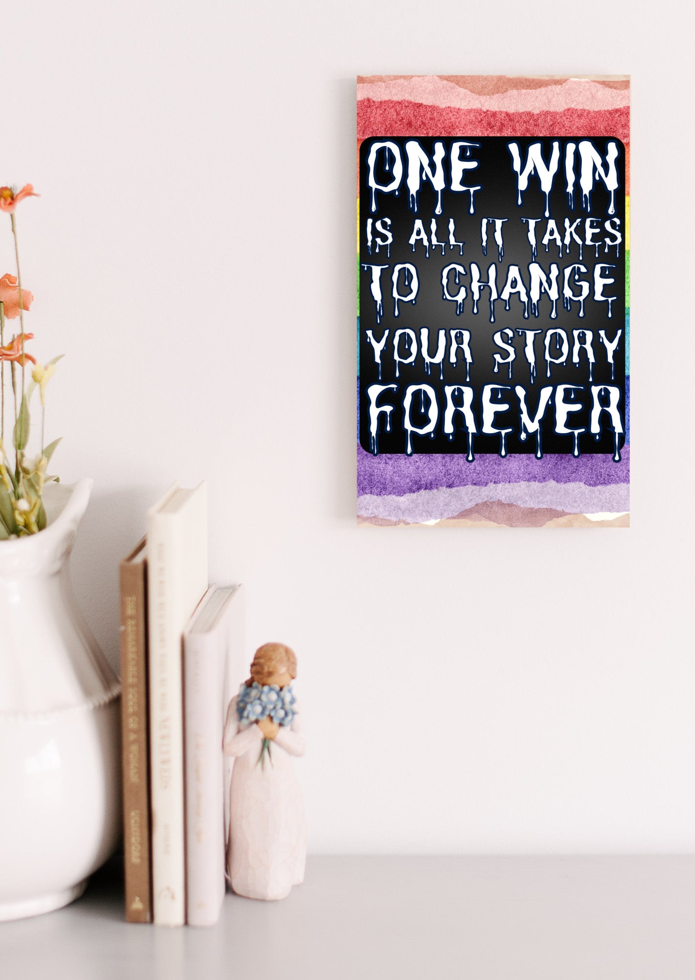 "Motivational wall plaque that reads ‘One Win Is All It Takes to Change Your Story Forever’ displayed above a desk workspace"
