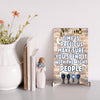 Emotional quote plaque reading “Time Is Precious” in soft script on neutral wood background, styled in a cozy living room setting with natural light.